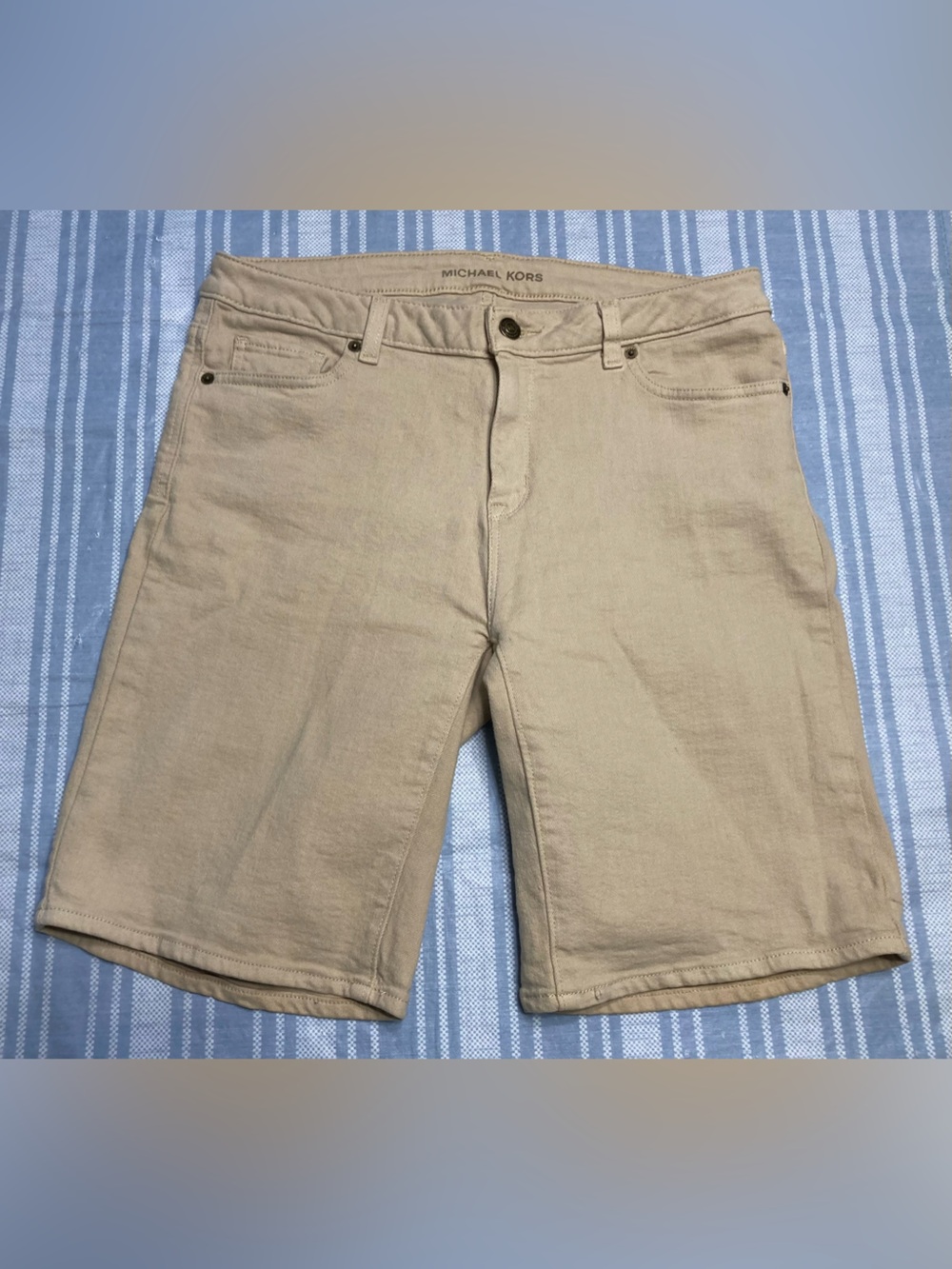 Michael Kors tan Bermuda shorts.